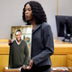 Assistant District Attorney Mischeka Nicholson shows the jury a photo of victim Botham Jean during closing remarks in the sentencing phase of former Dallas Police Officer Amber Guyger’s murder trial, Wednesday, Oct. 2, 2019, in Dallas.